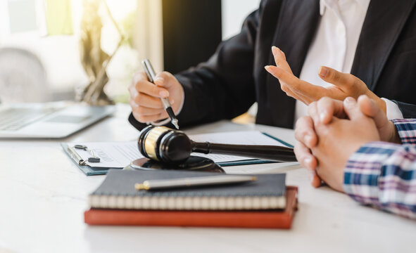 Justice Lawyer Meeting With Contract Papers And Judge Gavel On Tabel In Courtroom. Attorney Working In Courtroom. Justice And Law, Attorney, Court Judge Concept.