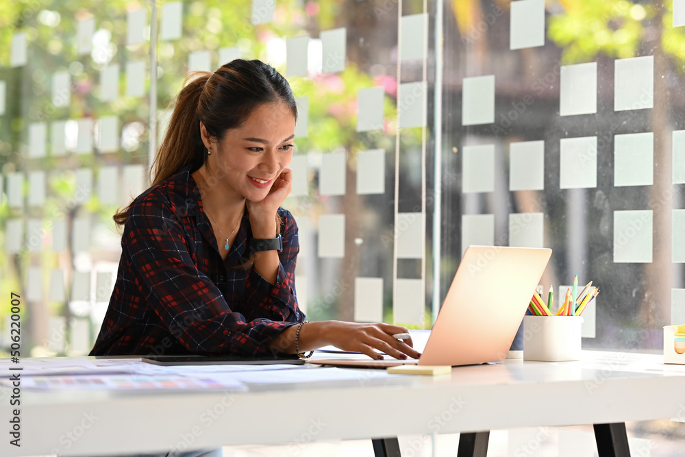 Poster asian female software designer works on a ux and ui mobile app template, freelance programmer workin