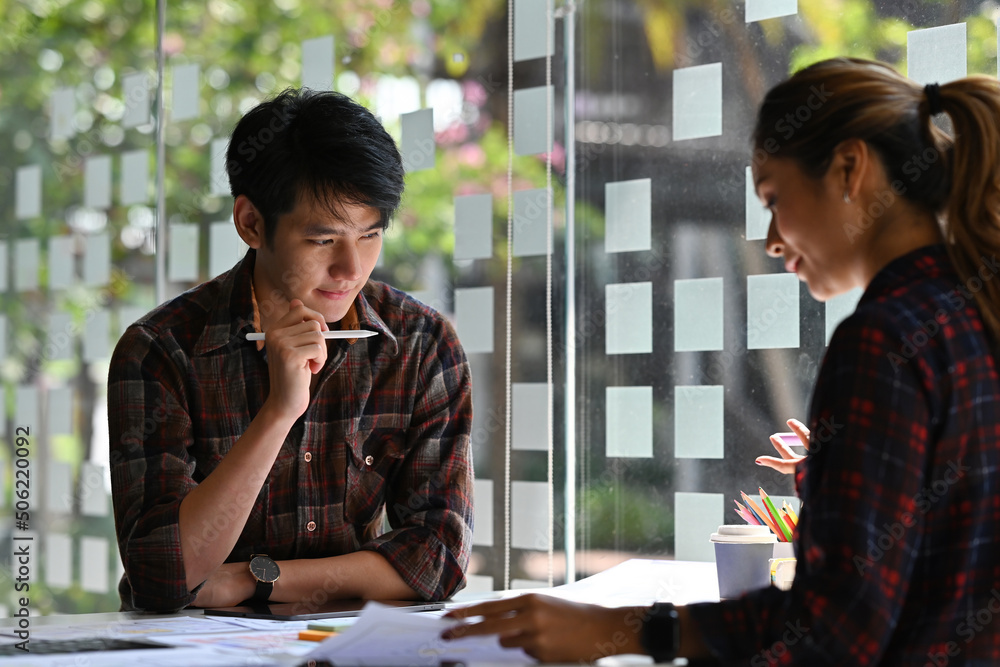Poster asian business handsome man looking thoughtful holding a digital pen while brainstroming idea about 