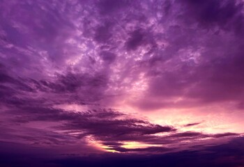 Naklejka na ściany i meble Dramatic sky with purple clouds due stormy weather at night.