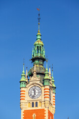 Fototapeta na wymiar Gdansk Glowny is the historic exterior of main railway station with clock tower, Poland