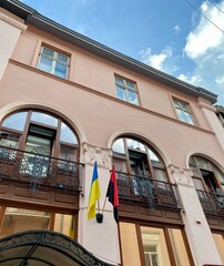 Blue yellow Urain flag and red black UPA flag on the faсade
