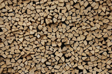 Wooden background or texture for your interior design. Chopped birch firewood