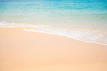 Fototapeta na wymiar Close up white sand beach sea waves splashing shoreline.