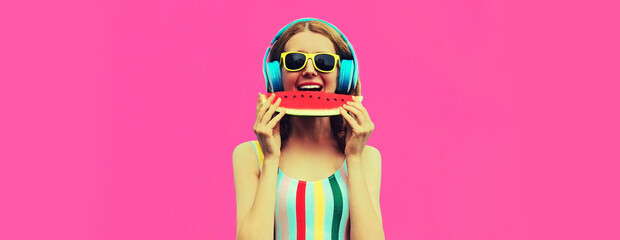 Summer colorful portrait of cheerful happy smiling young woman model posing in headphones listening to music with juicy slice of watermelon on pink background, blank copy space for advertising text