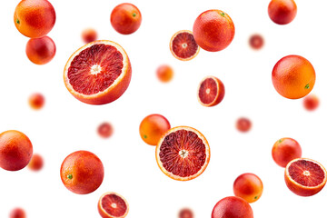 Falling red blood orange, isolated on white background, selective focus
