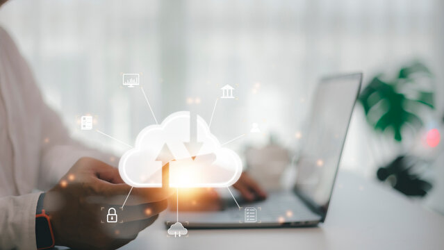 man use Laptop with cloud computing diagram show on hand. Cloud technology. Data storage. Networking and internet service concept.