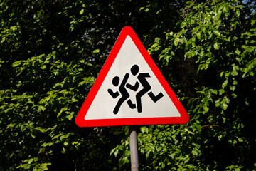 Warning signs. Children crossing. Street.