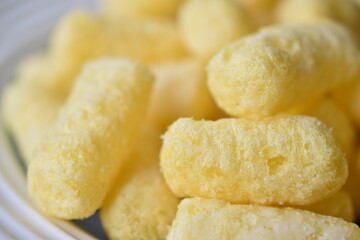 Sugar yellow corn sticks on a plate