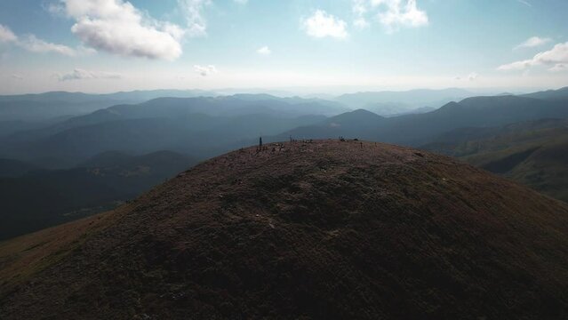 Aerial view of tourists climb to the top of the mountain Hoverla, Ukraine