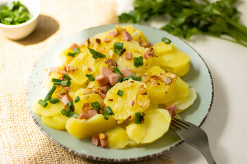 Traditional potato salad with onion and bacon - obrazy, fototapety, plakaty