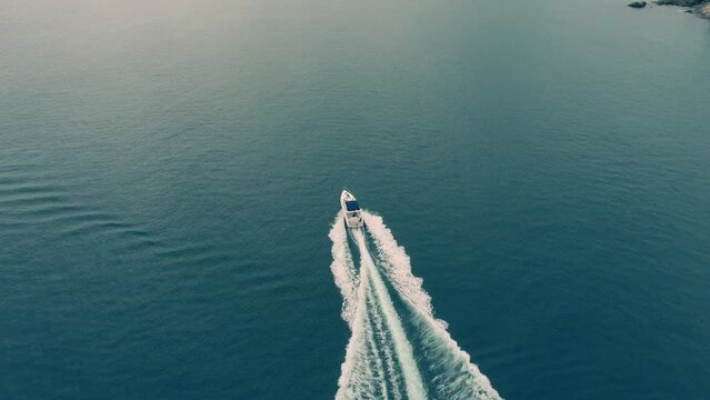 Aerial view of luxury speed boat cruising in the ocean.