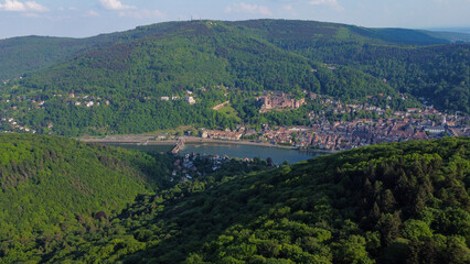 Fototapeta na wymiar green city in the valley with river