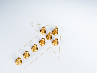 Gold moving forward arrows with the golden pawn chess piece team on white background. Leadership, teamwork, planning, uniqueness, and business growth and success concept.