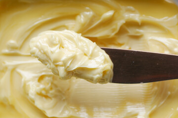 close up of fresh butter in a container 
