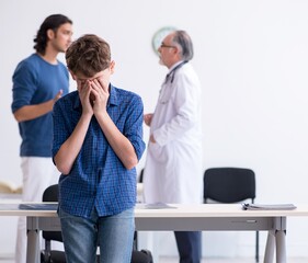 Fototapeta premium Young boy visiting doctor in hospital