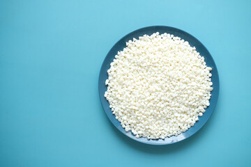 white Chocolate chips on a plate on table 