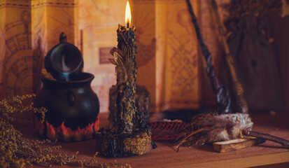 Magical illustration, esoteric concept. Candles and other magical stuff. Wicca and pagan attributes on a table	
