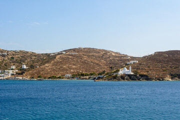 The port of Ios Island in Greece, a picturesque bay with a small settlement and characteristic...