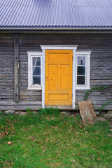 the yellow door of the old log-house