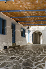 A street in the old town of Chora, the capital of Ios Island. Traditional Cycladic architecture....