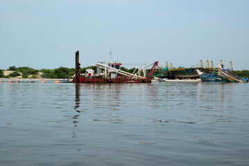 Fototapeta premium Hopper dredger at coastal Area