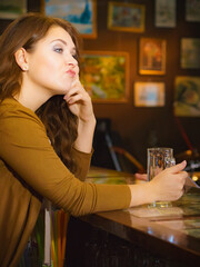 Girl drinking beer alcohol in pub club