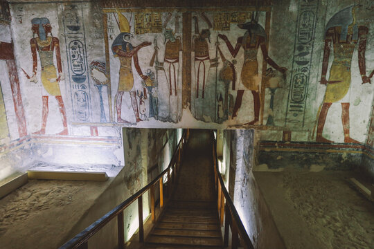 Luxor, Egypt - November 08, 2021: Majestic Interior View to the Corridor and Walls with hieroglyphics and other painting in the Pharaoh Tomb in the Valley of the Kings