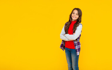 back to school. female fashion model. kid in casual clothes on yellow background.