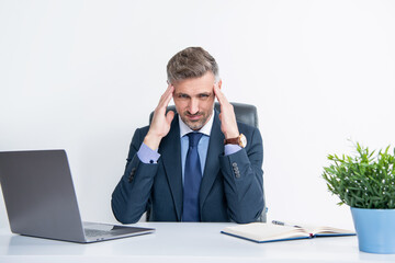 stressed overworked businessman sitting in business office