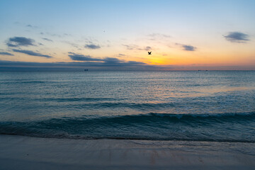 beautiful sundown with ocean water on the summer beach