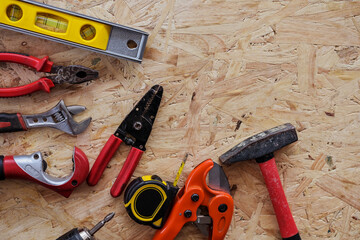 Different construction tools with Hand tools for home renovation on wooden board maintenance and reparing concept