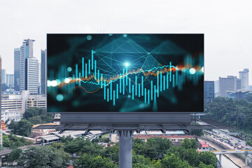 Forex and stock market chart hologram on road billboard over panorama city view of Kuala Lumpur. KL...
