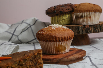 Chocolate muffin and walnut muffin, homemade bakery on dark background