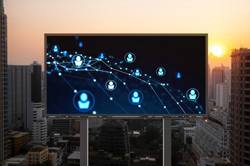 Glowing Social media icons on billboard over sunset panoramic city view of Bangkok. The concept of networking and establishing new connections between people and businesses in Southeast Asia