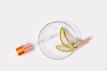 Glass petri dish with transparent pure serum for skin care