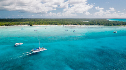 Fototapeta na wymiar Boat catamaran sails to the island view from above