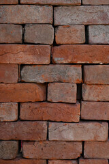 closeup the bunch red bricks keep the row soft focus natural red brown background.