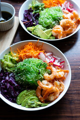 Shrimp Poke Bowl with Seaweed, Avocado, Cucumber, Radish, Cabbage, Sesame Seeds and Teriyaki Sauce