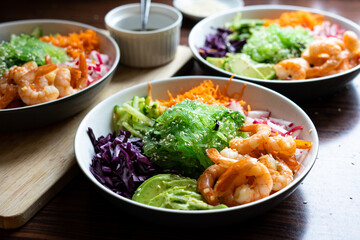 Shrimp Poke Bowl with Seaweed, Avocado, Cucumber, Radish, Cabbage, Sesame Seeds and Teriyaki Sauce