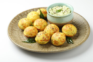 Kuzhi Paniyaram served with coconut chutney and sambar- South Indian breakfast with black lentils and rice