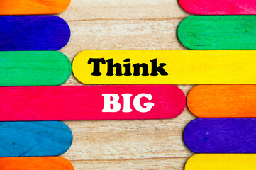 Think big text on colorful wooden stick - business concept