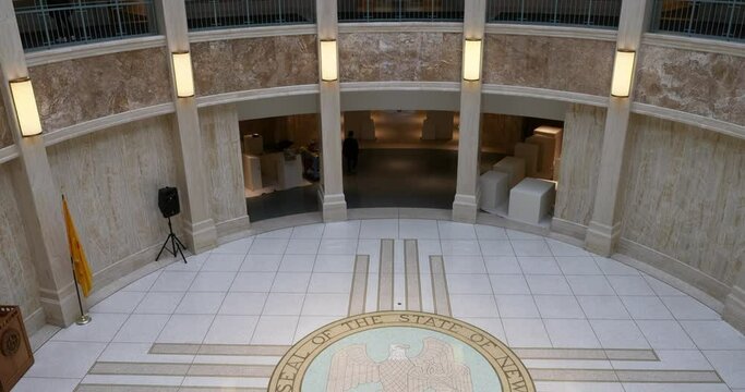 New Mexico State Capital rotunda inside tilt up 4K. Chambers and offices of the New Mexico State Legislature and Governor. Only round capitol building in USA. Polished marble columns, wall, floor.