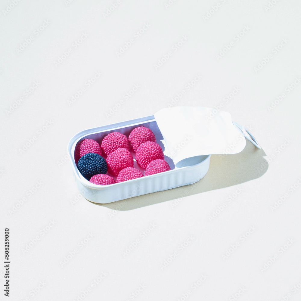 Wall mural soft and fluffy candies in a metal tin. simple and decorative design