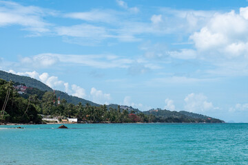 Tropical beach. Beautiful sandy beach with palm trees. Summer holidays and tourism