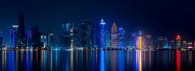 Doha skyline with many towers during the night.