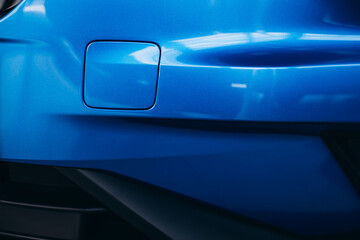 Headlights, car details of a car standing in car showroom