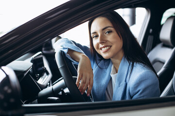 Woman sitting in her new car