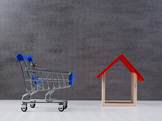Trolley and wooden house. Property concept.
