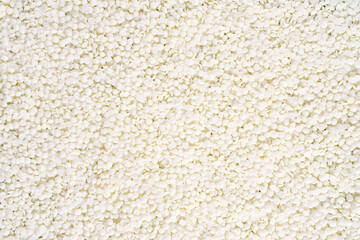 Full frame of soy wax flakes for candle making. Organic soy wax background for design, text. Top view. copy space. Flat lay. - obrazy, fototapety, plakaty